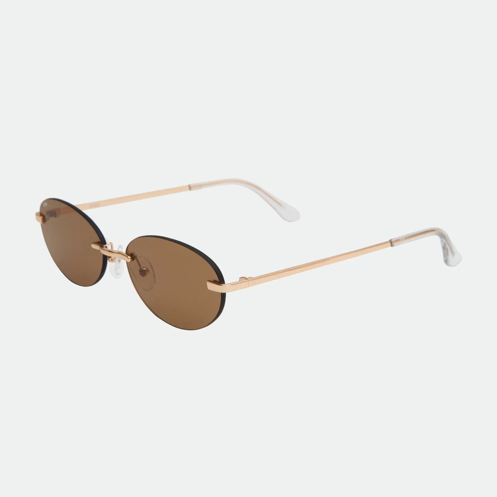 Beige sunglasses with brown lenses on a white background