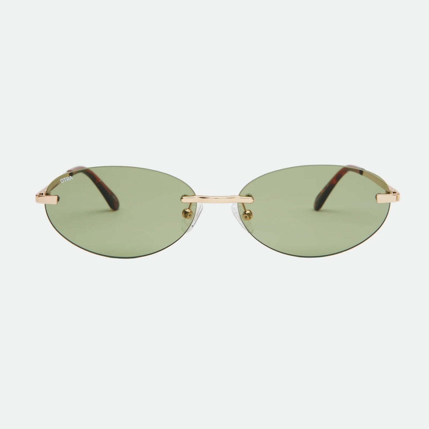 Sunglasses with gold frame and green lenses on a white background
