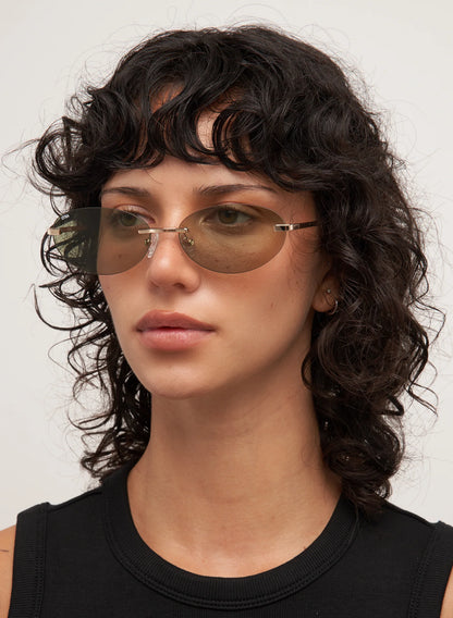 Woman wearing sunglasses with a neutral background