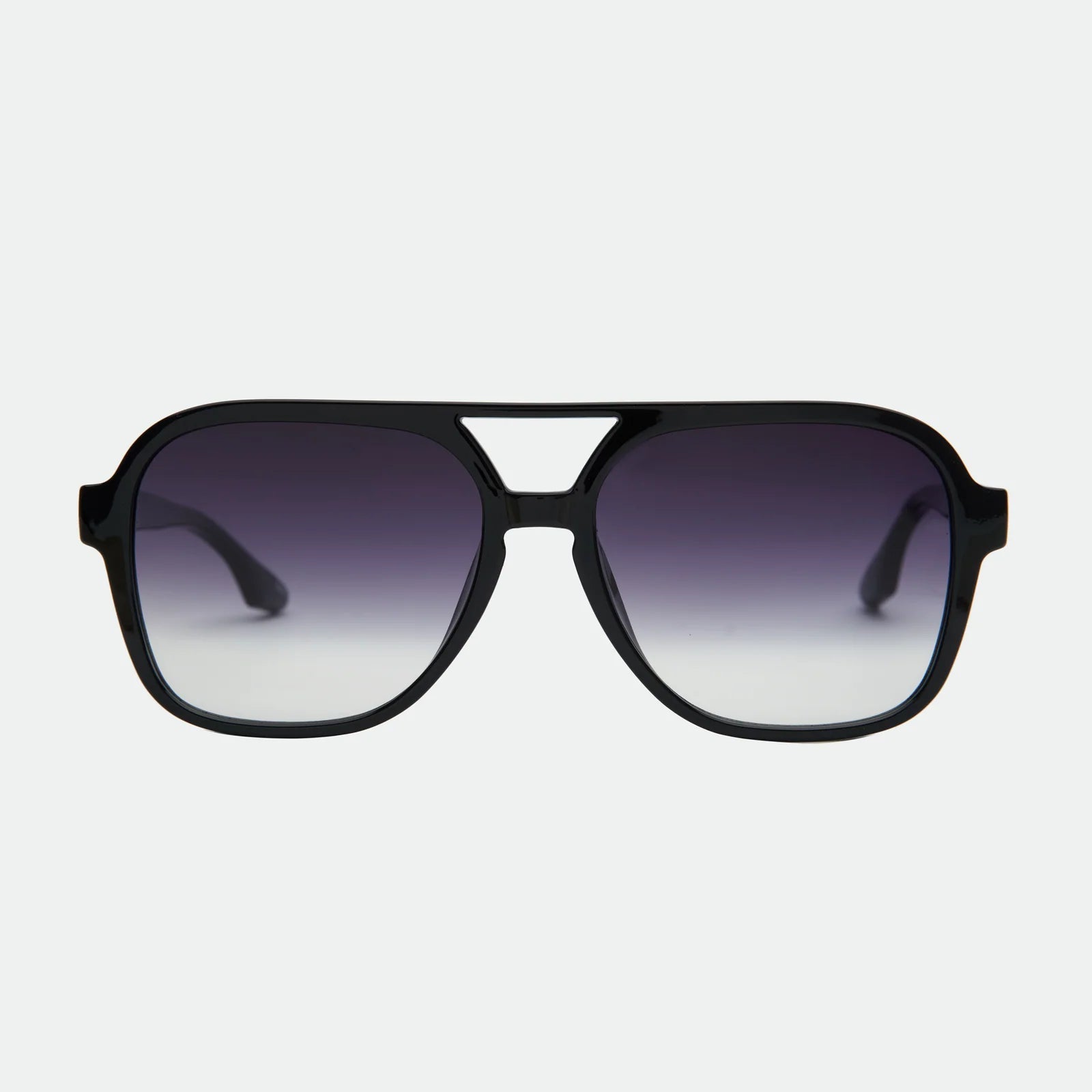 Black sunglasses with gradient lenses on a light gray background