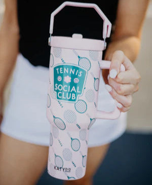 Person holding a pink water bottle with 'Tennis Social Club' branding