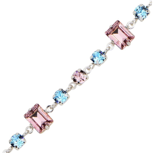 Jewelry bracelet with pink and blue swarovski crystals on a white background