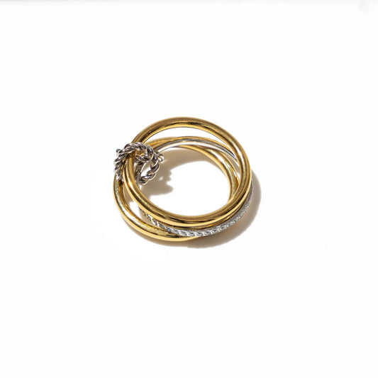 Set of gold and silver rings on a white background
