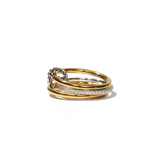 Set of three gold and silver rings on a white background