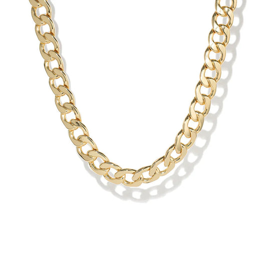 Gold chain necklace on a white background