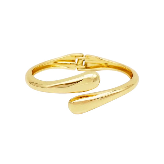 Gold bracelet on a white background