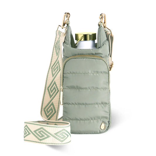Green insulated bottle holder with patterned strap on a white background