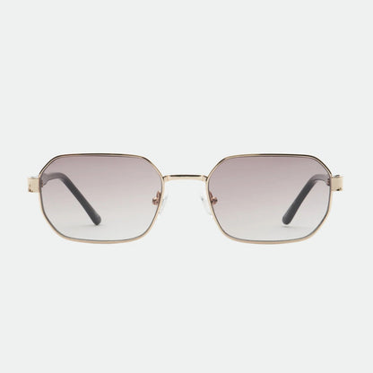 Sunglasses with gold frame and gradient lenses on a white background