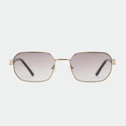 Sunglasses with gold frame and gradient lenses on a white background