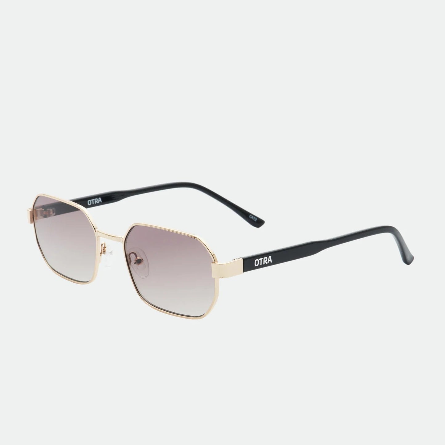 Sunglasses with gold frame and black arms on a white background