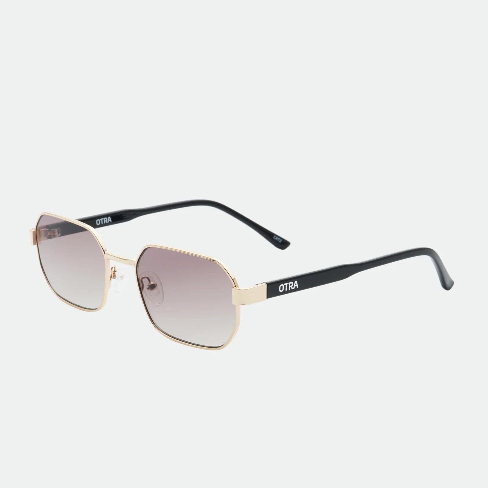 Sunglasses with gold frame and black arms on a white background