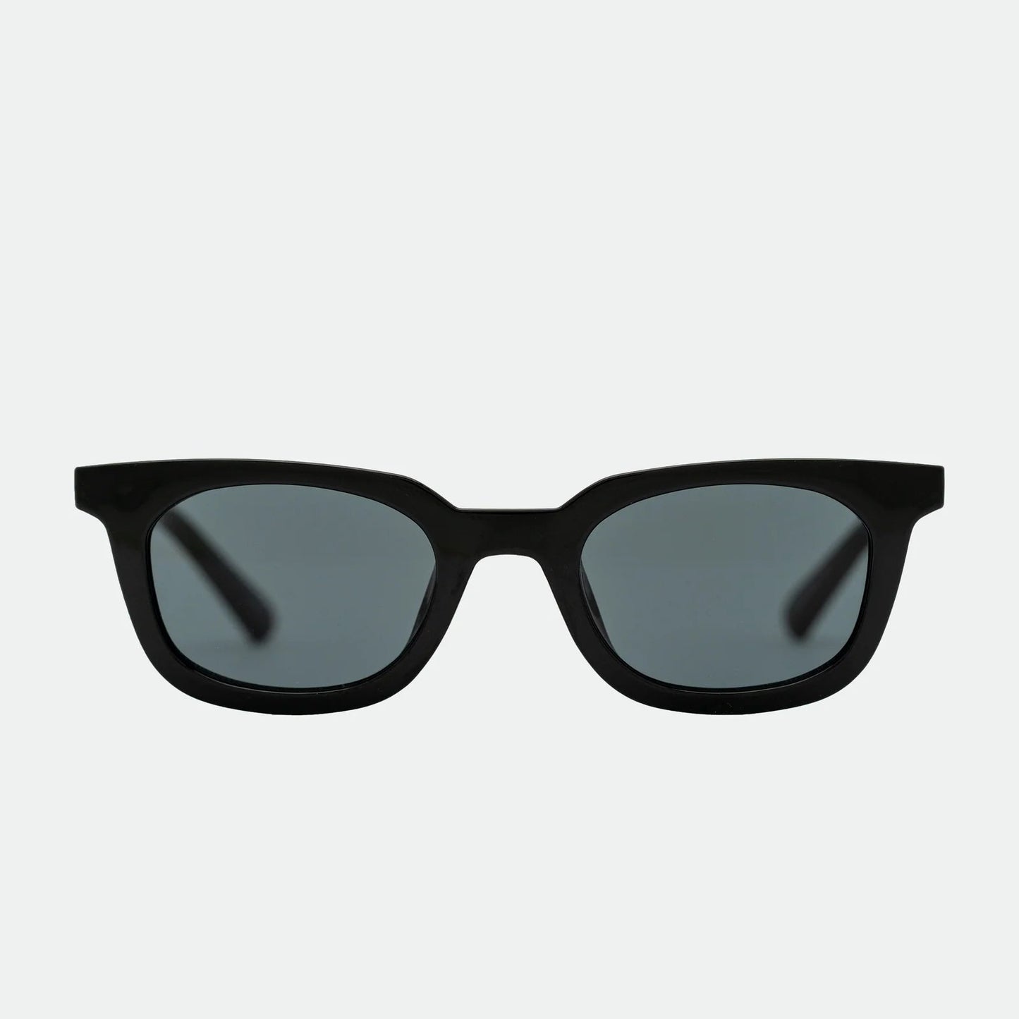 Black sunglasses with dark lenses on a white background