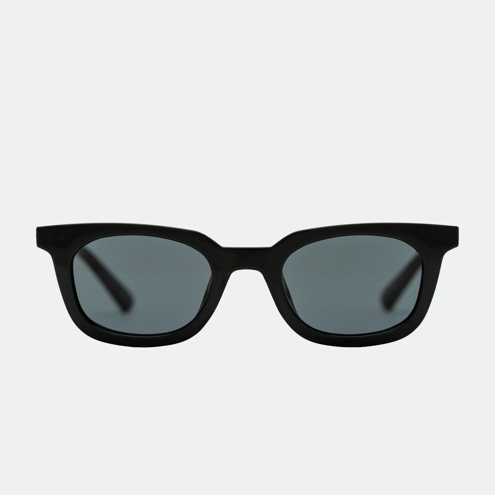 Black sunglasses with dark lenses on a white background