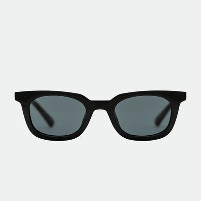 Black sunglasses with dark lenses on a white background