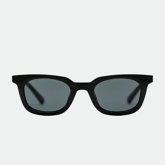 Black sunglasses with dark lenses on a white background