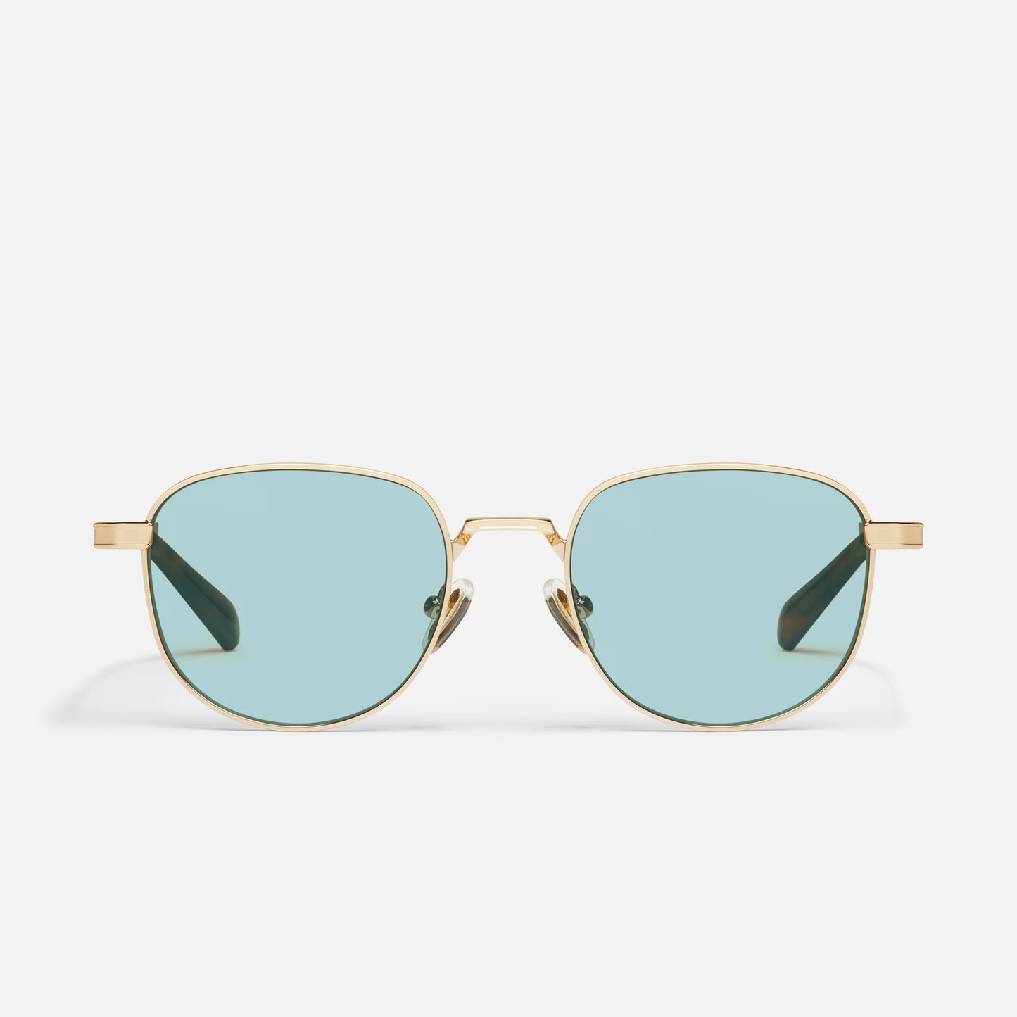 Gold-framed sunglasses with light blue lenses on a white background