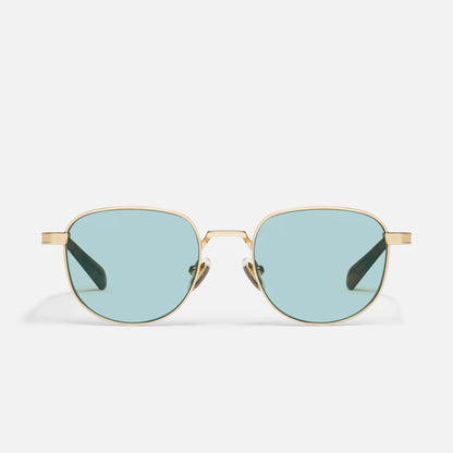 Gold-framed sunglasses with light blue lenses on a white background