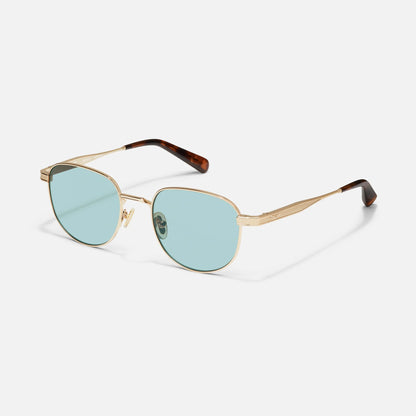 Gold-framed sunglasses with blue lenses on a white background