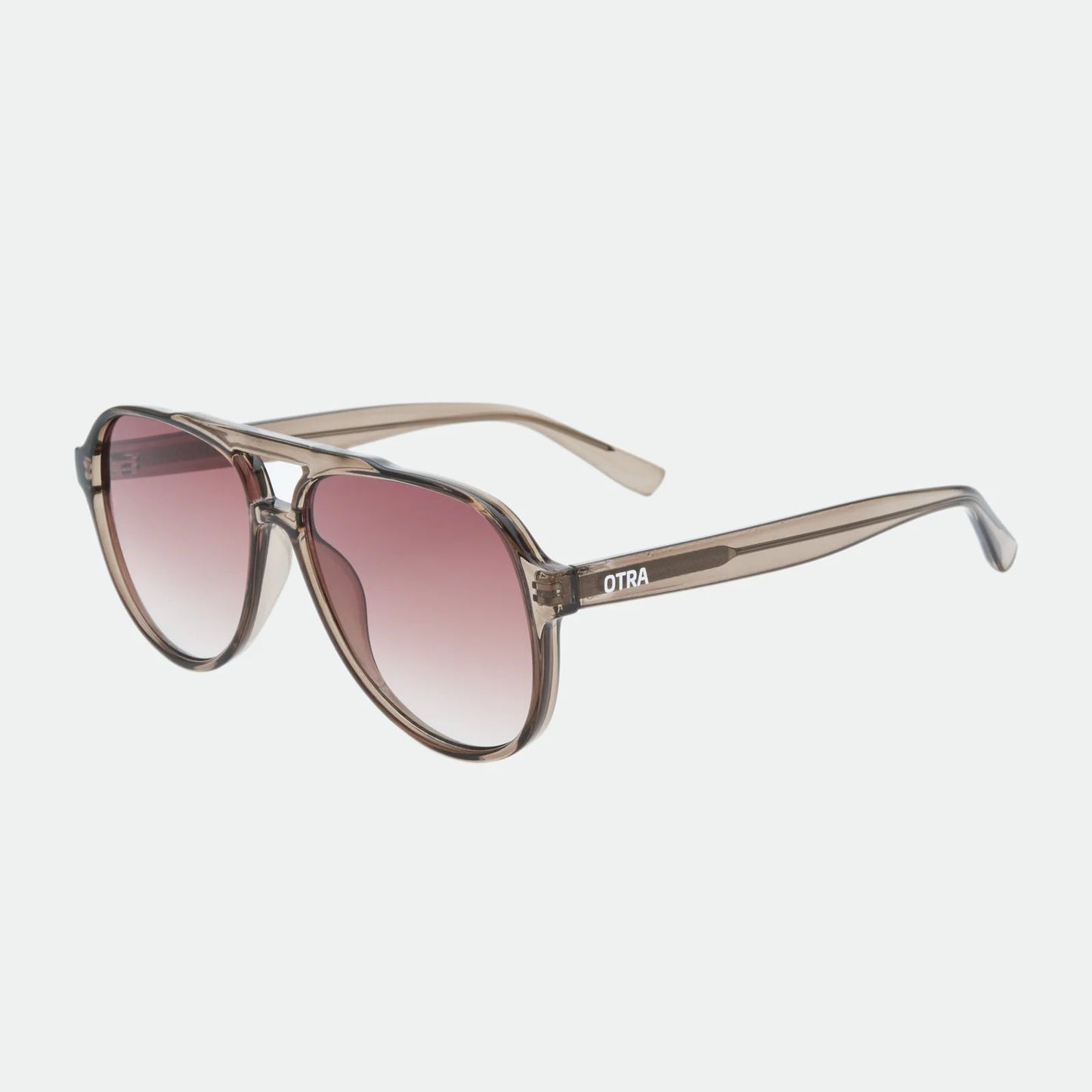 Sunglasses with a gradient pink lens on a white background
