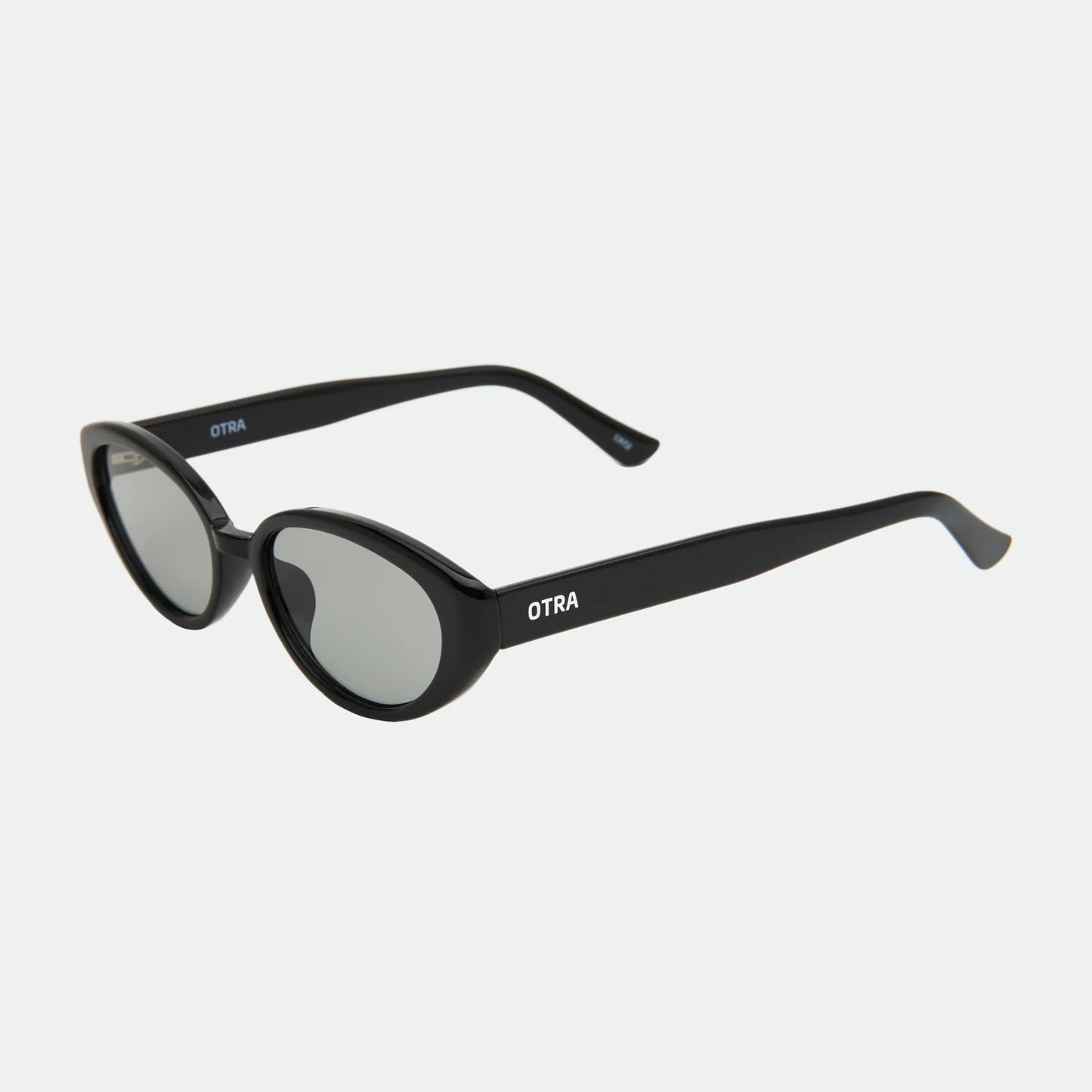 Black sunglasses with 'Otra' branding on a white background