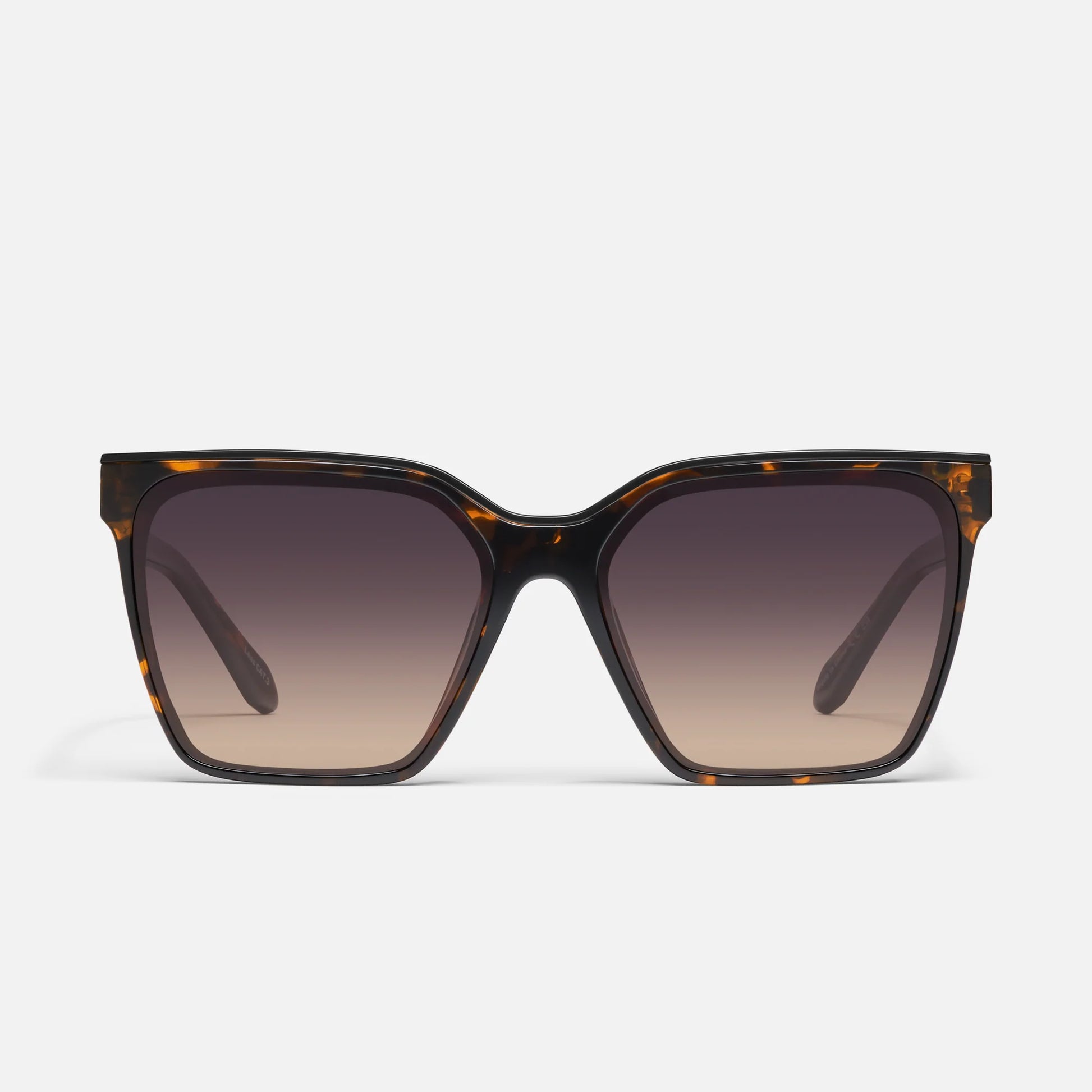 Sunglasses with tortoiseshell frame and gradient lenses on a white background