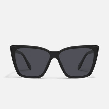 Black cat-eye sunglasses on a light gray background
