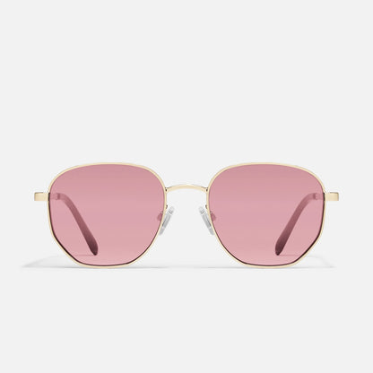 Sunglasses with pink lenses and gold frames on a white background