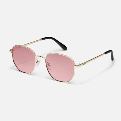 Sunglasses with pink lenses and gold frames on a white background