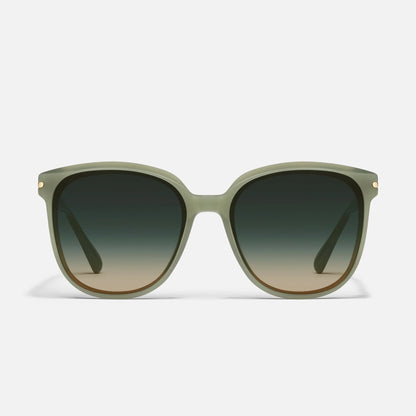 Sunglasses with green gradient lenses on a white background