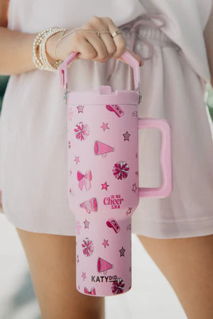 Person holding a pink water bottle with stars, bows and bullhorn designs