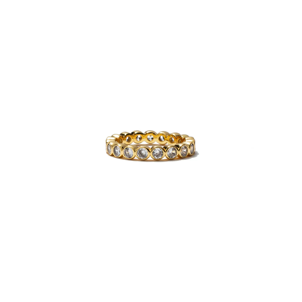 Gold ring with embedded stones on a white background