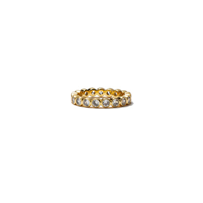 Gold ring with embedded stones on a white background