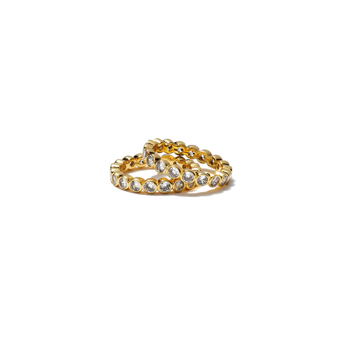 Gold ring with embedded stones on a white background