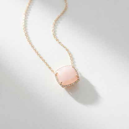 Necklace with a pink pendant on a light gray background