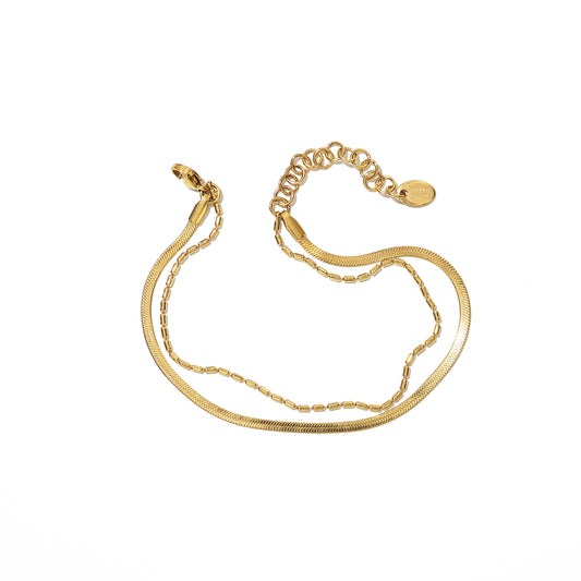 Gold anklet on a white background