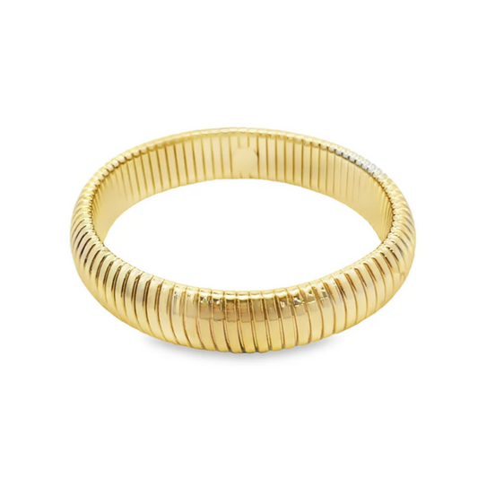 Gold bangle on a white background