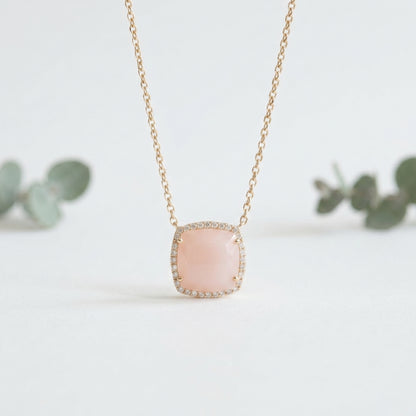 Necklace with a pink pendant on a light background