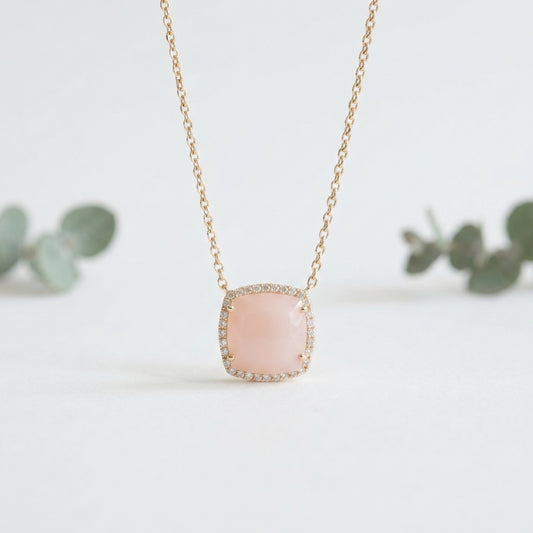 Necklace with a pink pendant on a light background