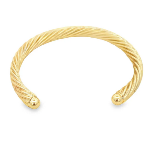 Gold bracelet on a white background