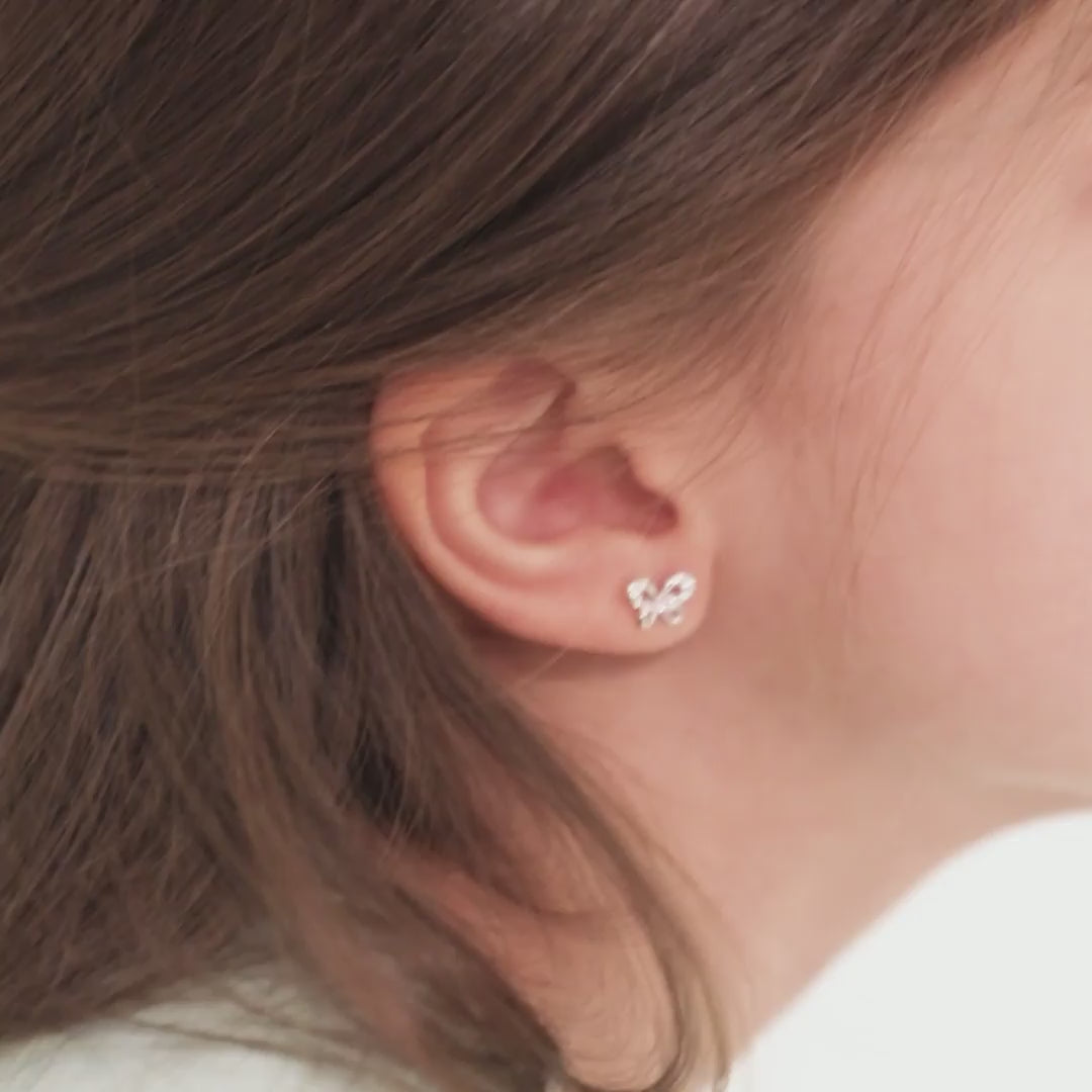 Age Group: Ideal for Infants, Toddlers and Girls; Safe for Sensitive Ears
925 Sterling Silver
Earrings Size: 9mm W x 6mm H Bow; 8mm post
Main Stone: Pink and Clear Cubic Zirconia
Metal Stamp: 925
Window Box Included
Video of a young girl wearing the butterfly earrings