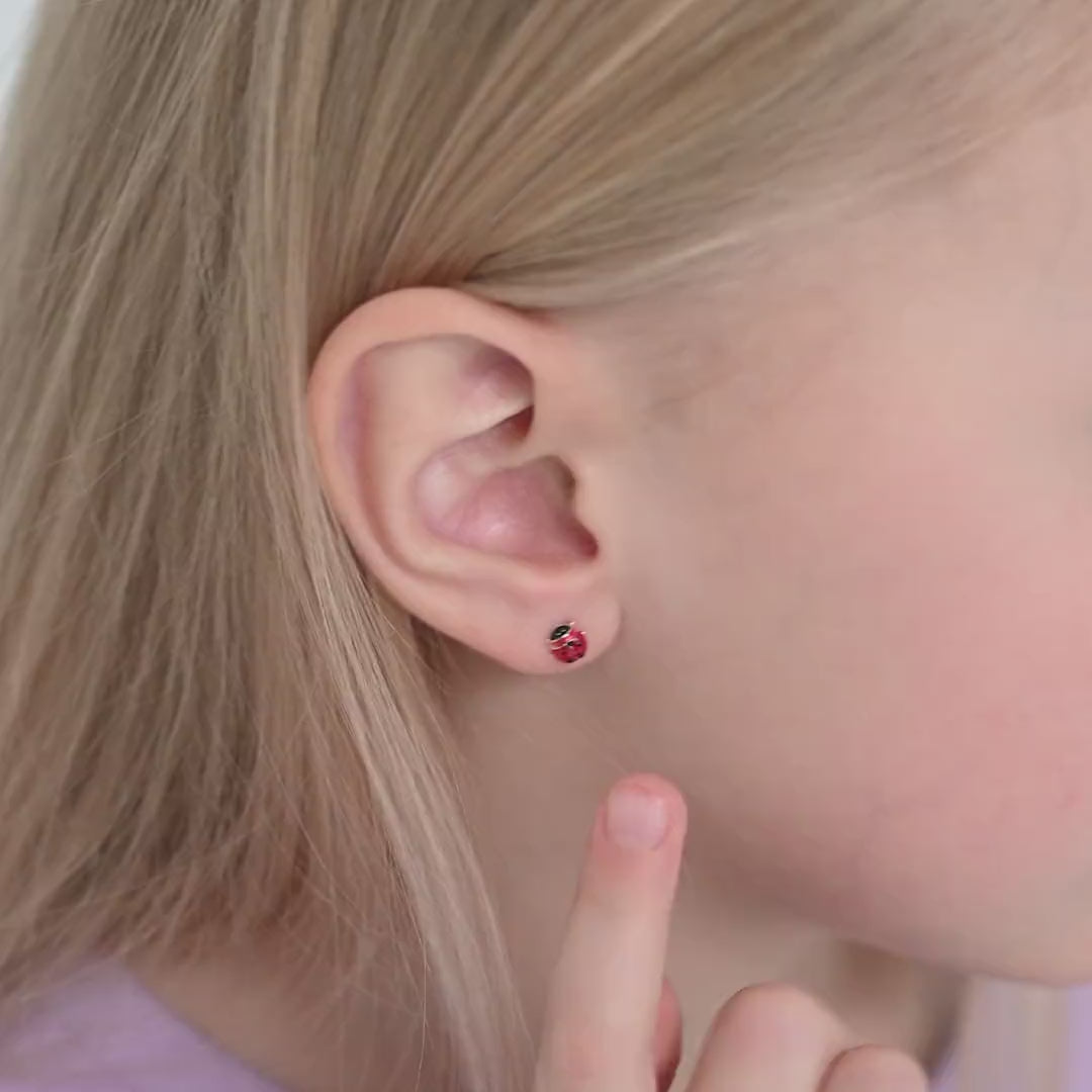 Age Group: Cute for Infants, Toddlers and Little Girls; Safe for Sensitive Ears
Material: 14k Yellow Gold
Earring Size: 5mm ladybug, enamel; 7mm threaded earring post
Color: Enamel
Metal Stamp: 14k
video Ladybud earrings on a young girl