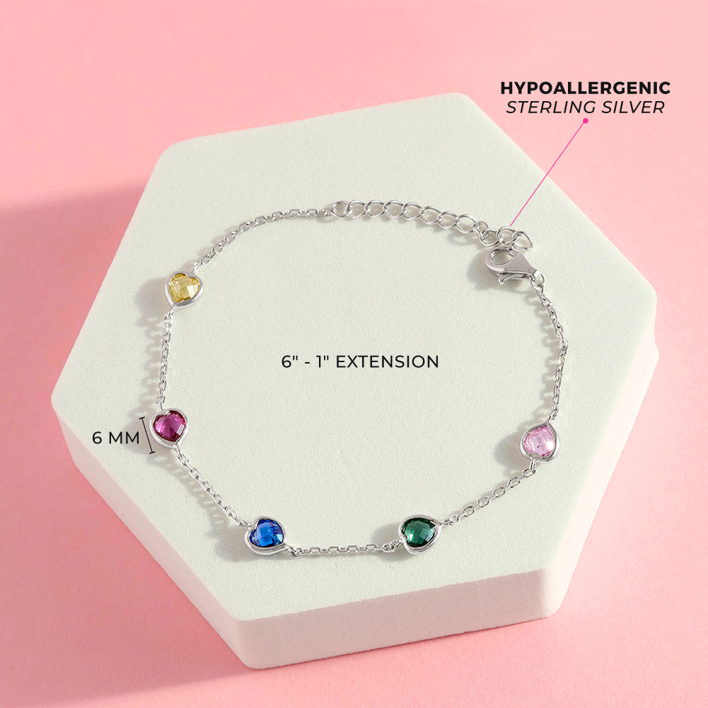 Age Group: Cute for Little Girls and Preteens; Safe for Sensitive Skin
Material: 925 Sterling Silver
Bracelet Length: 6 inches, 1 inch extension
Main Stone: Multi-Colored Cubic Zirconia
Metal Stamp: 925
Overhead picture of the full bracelet showing dimensions and listing materials