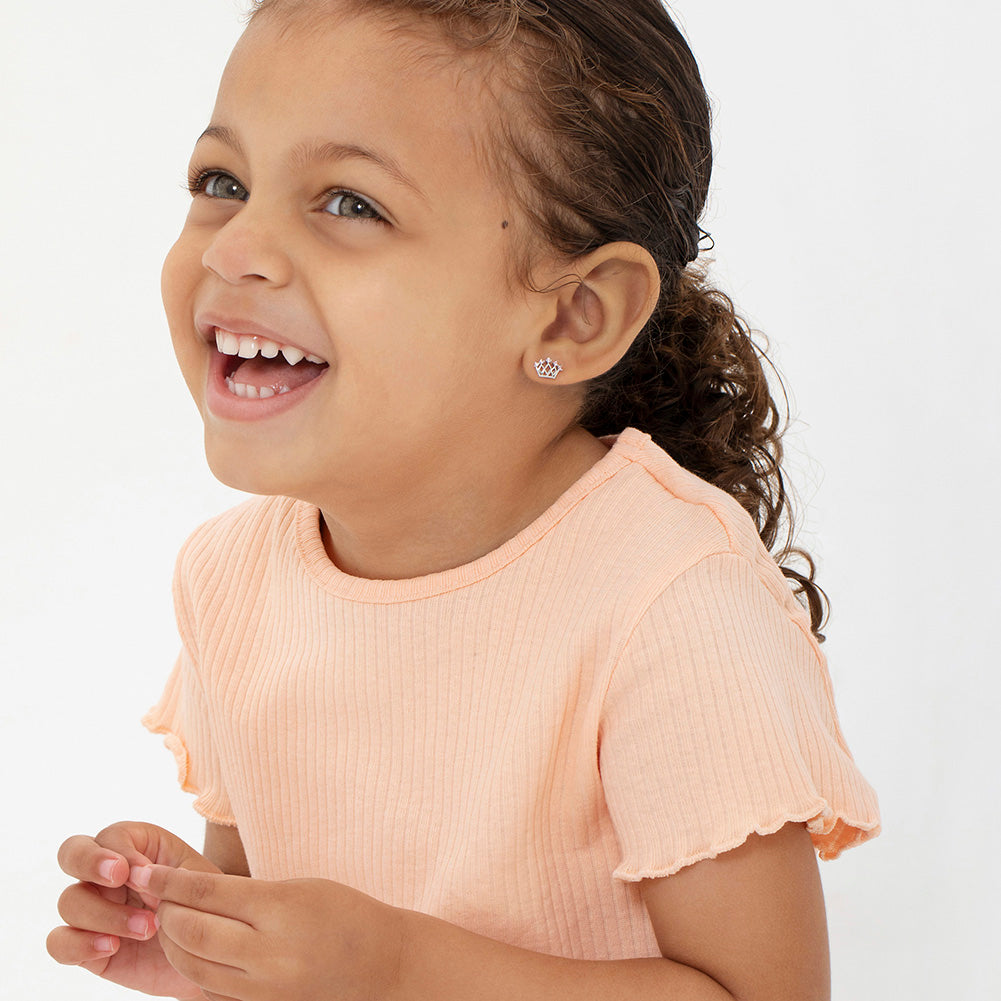 Age Group: Ideal for Toddlers, Young Girls or Pre-Teens; Safe for Sensitive Ears
Material: 925 Sterling Silver
Size: 10mm W x 7mm H crown; 9mm threaded earring post
Metal Stamp: 925
Window Box Included
5-point crown earrings with pink CZ. Picture close up of them with a toddler girl wearing them