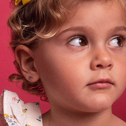 Age Group: Ideal for Toddlers and Little Girls
Size: 9mm W x 5mm H (green) watermelon; 7mm threaded earring post
Material: 925 Sterling Silver
Stone: Cubic Zirconia
Metal Stamp: 925
Window Box Included
picture of a little girl wearing the earrings