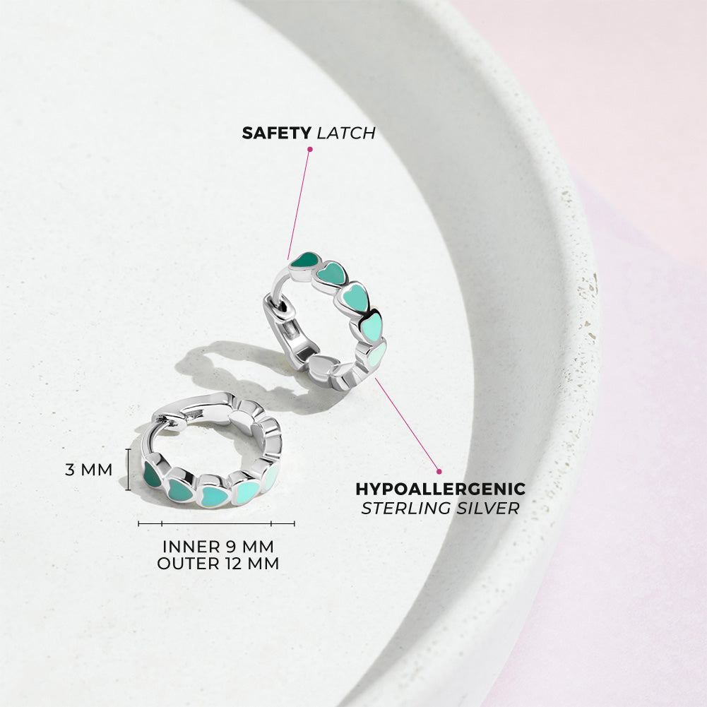 Age Group: Cute for Girls or Teens; Safe for Sensitive Ears
925 Sterling Silver
Earring Size: Outer: 0.47 in. (12mm); Inner: 0.35 in. (9mm)
Metal Stamp: 925
Cascading heart design with multiple green tone earrings on sterling silver. Picture of close up with measurements and materials listed. 