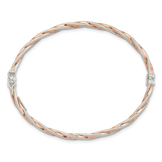 Two-tone silver and rose gold bracelet on a white background
Material: .925 sterling Silver Rose-tone Satin
Color: rose gold tone, silver twisted design
Closure: box latch
Measurement: 7" circumference, 3 mm width