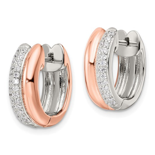 Pair of rose gold and silver hoop earrings on a white background
Material: sterling silver, rose-toned (Flash Plating), pave CZ
Color: silver and rose-gold
Closure: Post, Notch, Lock
Measurement: 6.05 mm thickness, 16.5 mm length, 15.2 mm width