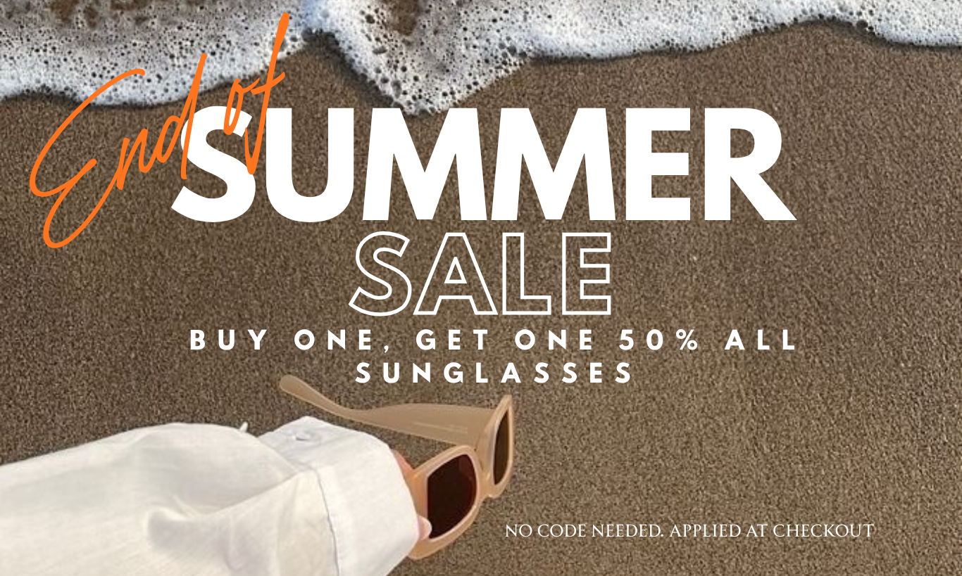 Promotional sale graphic with the text 'End of Summer Sale' over a beach scene, featuring a white sleeve holding a pair of sunglasses on sand with ocean foam at the top.