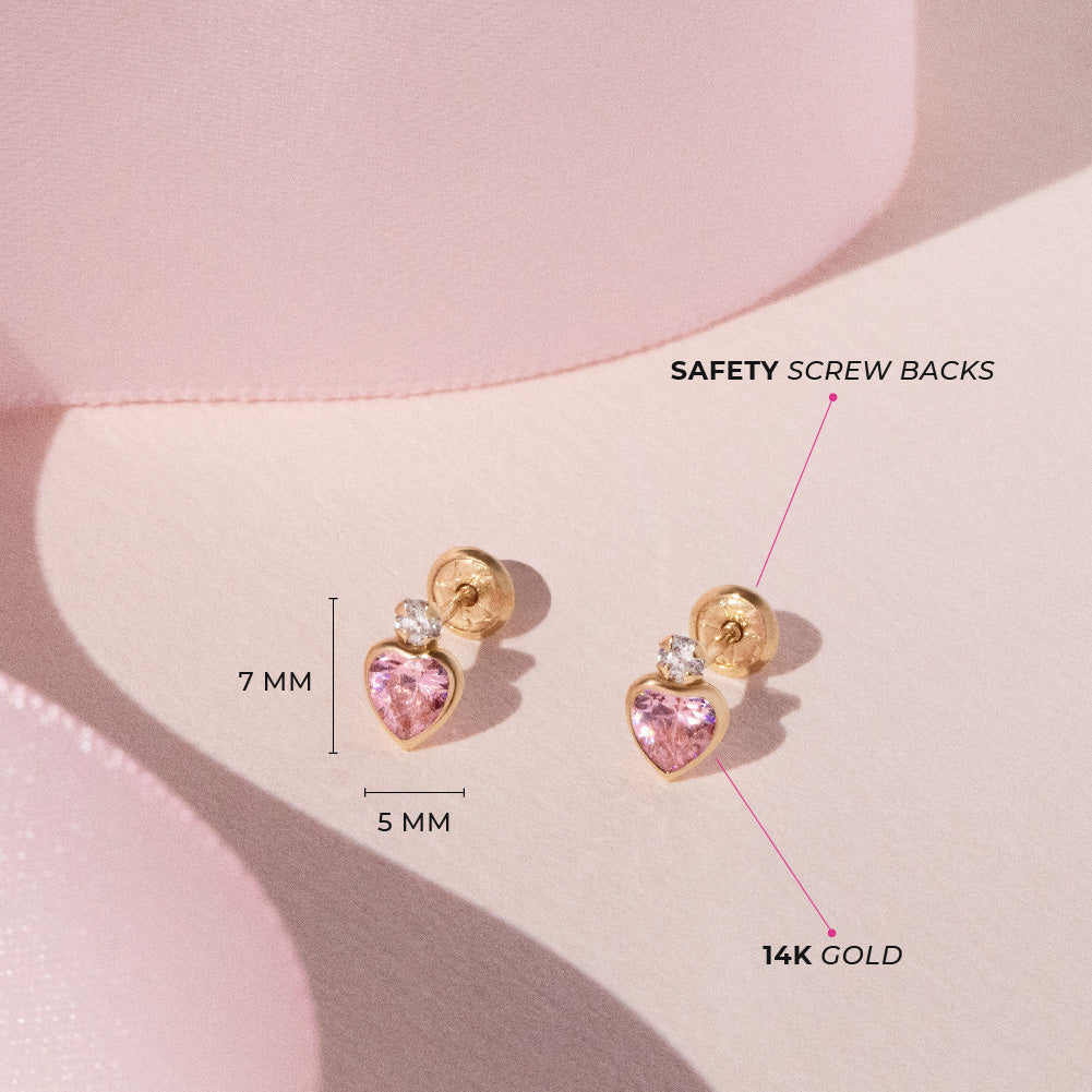 Age Group: Adorable for Infants, Toddlers &amp; Little Girls; Safe for Sensitive Skin
Material: 14k Yellow Gold
Earring Size: 5mm W x 6mm H (pink) heart, (clear) round cubic zirconia; 8mm threaded post
Main Stone: Clear &amp; Pink Cubic Zirconia
Metal Stamp: 14k
picture of gold and pink heart earrings with the measurements and material details 